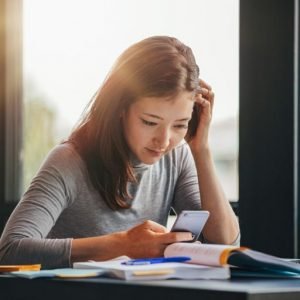smart woman thinking library