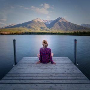 Woman Seating by the Jetty